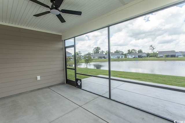 1514 Saw Palmetto St, North Myrtle Beach, SC 29582 - unfurnished sunroom featuring a water view, a ceiling fan, and a residential view