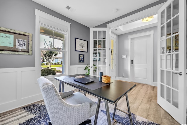 2336 Tidewatch Way N, Myrtle Beach, SC 29582 - office area featuring light wood finished floors, french doors, wainscoting, and a decorative wall