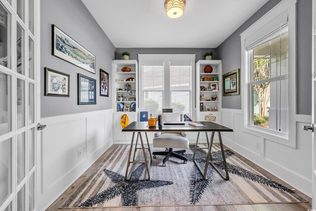 2336 Tidewatch Way N, Myrtle Beach, SC 29582 - office space featuring wood finished floors, healthy amount of natural light, a wainscoted wall, and a decorative wall