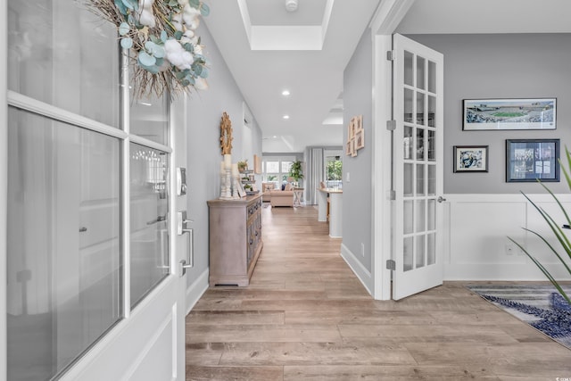 2336 Tidewatch Way N, Myrtle Beach, SC 29582 - corridor featuring light wood-style floors, french doors, a skylight, and recessed lighting