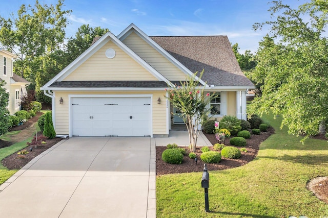 2336 Tidewatch Way N, Myrtle Beach, SC 29582 - traditional-style house with concrete driveway, a shingled roof, a front lawn, and a garage