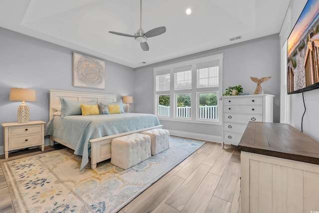 2336 Tidewatch Way N, Myrtle Beach, SC 29582 - bedroom with wood finished floors, a tray ceiling, a ceiling fan, and recessed lighting
