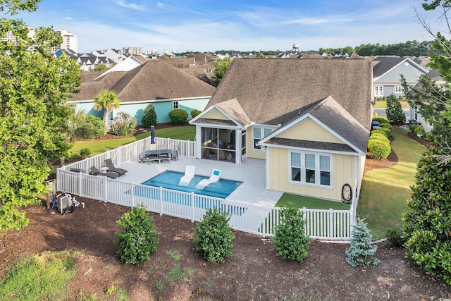 2336 Tidewatch Way N, Myrtle Beach, SC 29582 - rear view of property with a sunroom, a fenced backyard, a patio, and roof with shingles