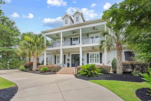 155 Preservation Cir, Pawleys Island, SC 29585 - view of front of home featuring a ceiling fan, covered porch, a balcony, and a front yard