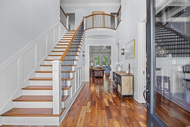 155 Preservation Cir, Pawleys Island, SC 29585 - foyer featuring a decorative wall, stairs, wood finished floors, crown molding, and french doors