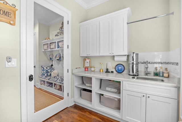 155 Preservation Cir, Pawleys Island, SC 29585 - kitchen with crown molding, white cabinets, light countertops, dark wood-style flooring, and open shelves