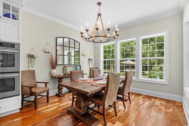 155 Preservation Cir, Pawleys Island, SC 29585 - dining space with a chandelier, ornamental molding, and light wood finished floors