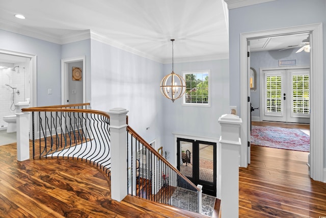 155 Preservation Cir, Pawleys Island, SC 29585 - stairway featuring french doors, wood finished floors, a chandelier, ornamental molding, and recessed lighting