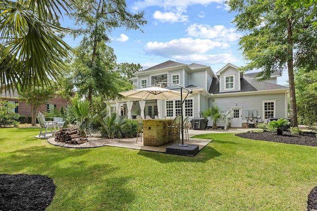 155 Preservation Cir, Pawleys Island, SC 29585 - back of property with a patio, a yard, french doors, and roof with shingles