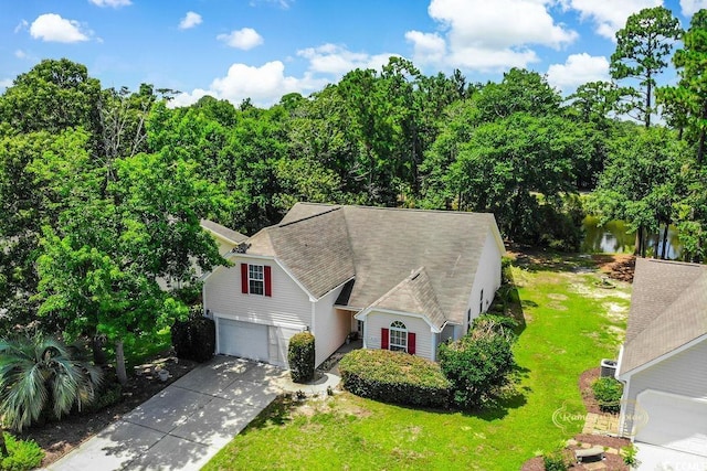 4570 Fringetree Dr, Murrells Inlet, SC 29576 - view of front of home featuring driveway, an attached garage, a front lawn, and a shingled roof