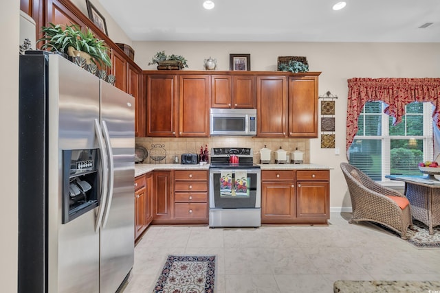 327 Trestle Way, Conway, SC 29526 - kitchen featuring stainless steel appliances, decorative backsplash, recessed lighting, and brown cabinetry