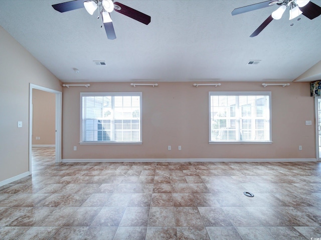 708 Shenanigan Loop, Murrells Inlet, SC 29576 - unfurnished room with ceiling fan, lofted ceiling, and a textured ceiling