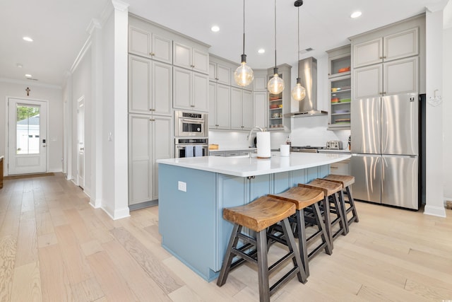 6304 Chadderton Cir, Myrtle Beach, SC 29579 - kitchen featuring freestanding refrigerator, wall chimney range hood, light wood-style flooring, light countertops, and ornamental molding