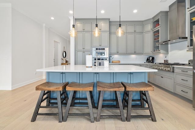 6304 Chadderton Cir, Myrtle Beach, SC 29579 - kitchen featuring gray cabinetry, appliances with stainless steel finishes, a breakfast bar, crown molding, and backsplash