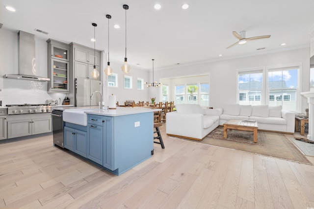 6304 Chadderton Cir, Myrtle Beach, SC 29579 - kitchen featuring open floor plan, appliances with stainless steel finishes, a ceiling fan, gray cabinetry, and wall chimney exhaust hood