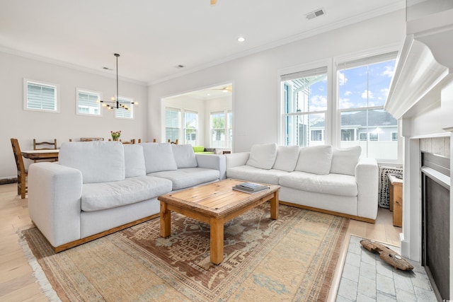 6304 Chadderton Cir, Myrtle Beach, SC 29579 - living room with ornamental molding, recessed lighting, a fireplace, and light wood-style flooring