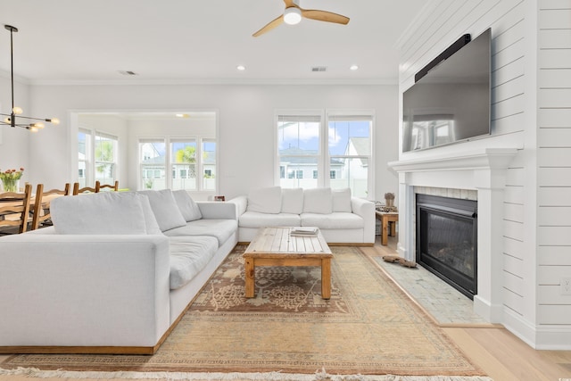 6304 Chadderton Cir, Myrtle Beach, SC 29579 - living area featuring ceiling fan, a fireplace with flush hearth, crown molding, light wood-type flooring, and recessed lighting