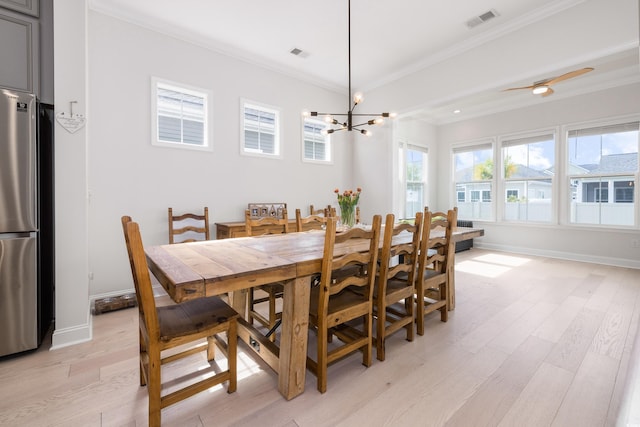 6304 Chadderton Cir, Myrtle Beach, SC 29579 - dining space featuring crown molding, light wood finished floors, and a chandelier