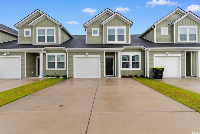 623 Harrison Mill St Unit 623, Myrtle Beach, SC 29579 - view of front facade with board and batten siding, driveway, and roof with shingles