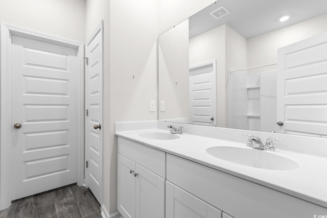 623 Harrison Mill St Unit 623, Myrtle Beach, SC 29579 - full bathroom featuring double vanity, wood finished floors, and a shower