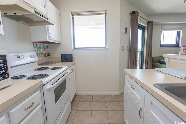 5905 S Kings Hwy Unit 1414, Myrtle Beach, SC 29575 - kitchen with white range with electric cooktop, under cabinet range hood, light countertops, and white cabinets