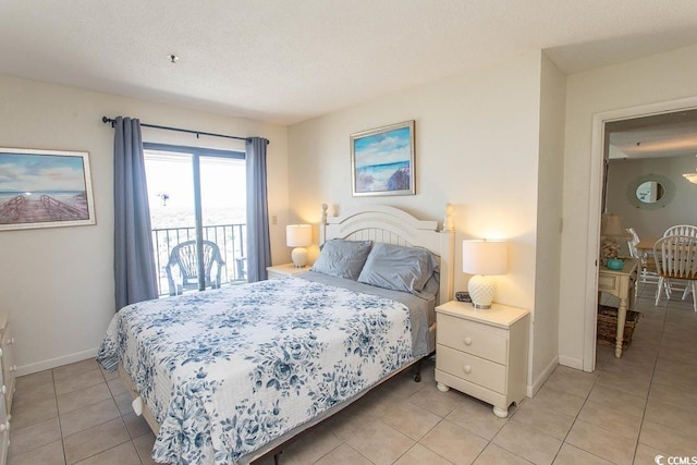 5905 S Kings Hwy Unit 1414, Myrtle Beach, SC 29575 - bedroom featuring access to exterior, light tile patterned floors, and a textured ceiling