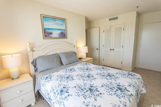 5905 S Kings Hwy Unit 1414, Myrtle Beach, SC 29575 - bedroom with a closet and light tile patterned floors