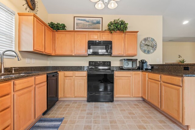 1133 Spalding Ct, Surfside Beach, SC 29575 - kitchen with black appliances, a peninsula, dark stone countertops, recessed lighting, and light brown cabinets
