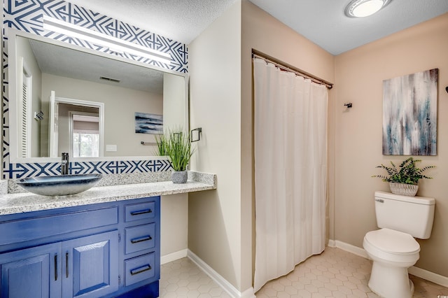 10056 Kings Rd, Myrtle Beach, SC 29572 - bathroom with vanity, tile patterned flooring, a shower with curtain, and a textured ceiling