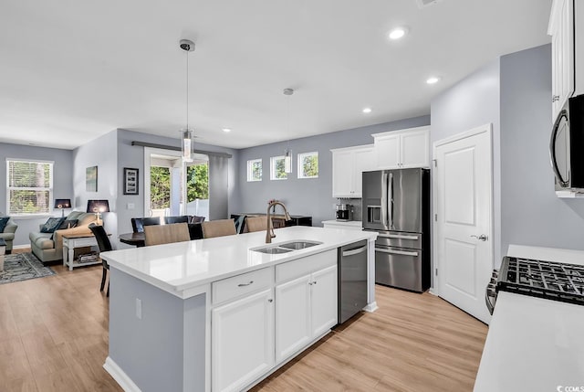 520 Cattle Drive Cir, Myrtle Beach, SC 29588 - kitchen with stainless steel appliances, open floor plan, an island with sink, light wood-type flooring, and recessed lighting