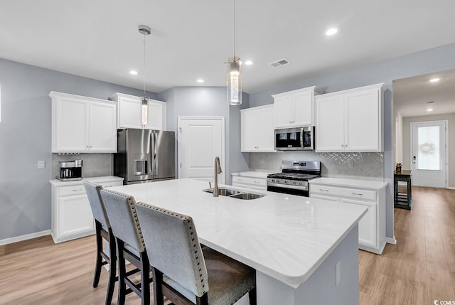 520 Cattle Drive Cir, Myrtle Beach, SC 29588 - kitchen with stainless steel appliances, light wood finished floors, backsplash, light countertops, and recessed lighting