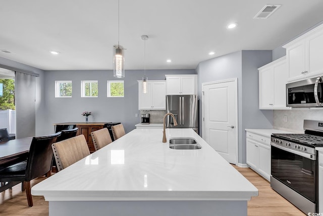 520 Cattle Drive Cir, Myrtle Beach, SC 29588 - kitchen with stainless steel appliances, tasteful backsplash, light countertops, light wood-style floors, and recessed lighting