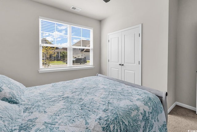 520 Cattle Drive Cir, Myrtle Beach, SC 29588 - bedroom with carpet flooring, a closet, and a ceiling fan