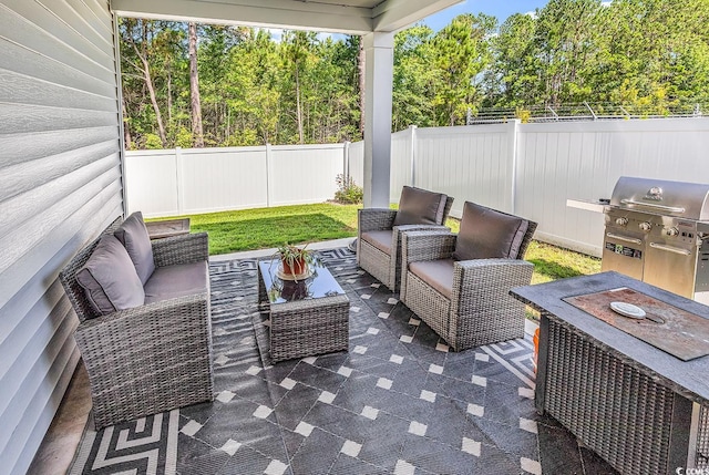 520 Cattle Drive Cir, Myrtle Beach, SC 29588 - fenced backyard featuring an outdoor living space, grilling area, a patio area, and view of wooded area