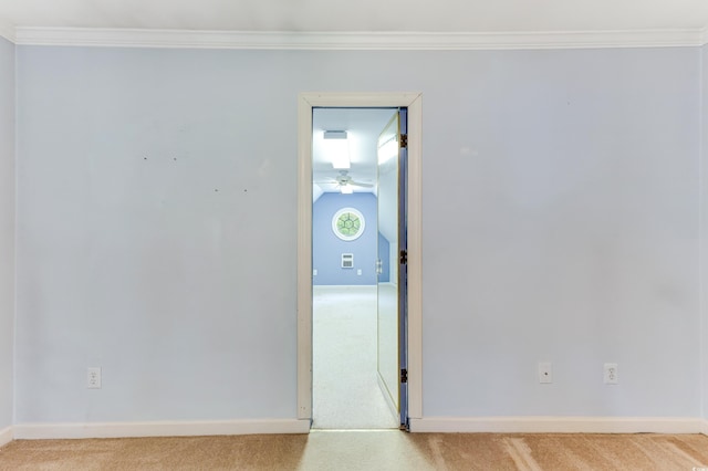 469 White Heron Ct SW, Sunset Beach, NC 28468 - empty room with light carpet, ornamental molding, and a ceiling fan