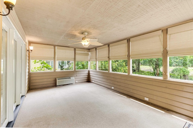 469 White Heron Ct SW, Sunset Beach, NC 28468 - unfurnished sunroom featuring carpet floors, a ceiling fan, and a wall mounted air conditioner