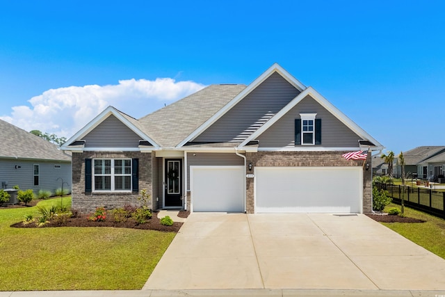 215 Kendrick St, Little River, SC 29566 - view of front of property featuring driveway and brick siding