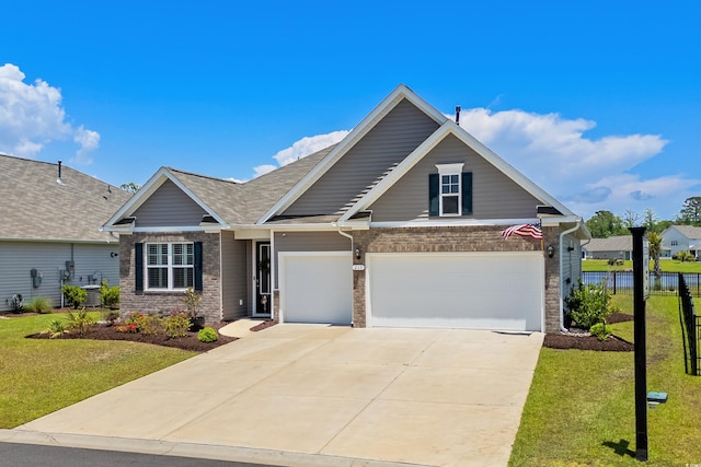 215 Kendrick St, Little River, SC 29566 - traditional-style house featuring brick siding, concrete driveway, a garage, and a shingled roof
