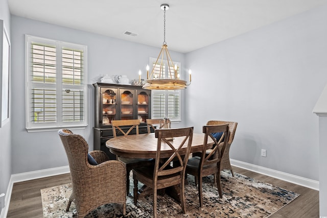 215 Kendrick St, Little River, SC 29566 - dining area featuring a chandelier and wood finished floors