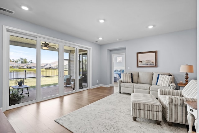 215 Kendrick St, Little River, SC 29566 - living room featuring wood finished floors, a water view, a ceiling fan, and recessed lighting