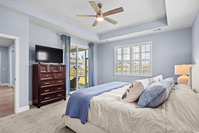 215 Kendrick St, Little River, SC 29566 - bedroom featuring access to outside, light carpet, and ceiling fan