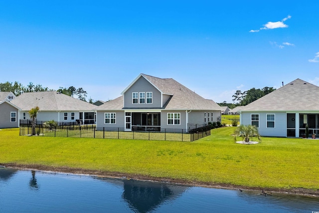 215 Kendrick St, Little River, SC 29566 - rear view of house with a water view, a sunroom, and a fenced backyard