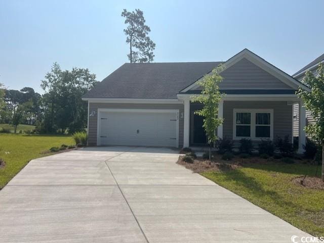 9723 Indigo Creek Blvd, Murrells Inlet, SC 29576 - view of front of property featuring driveway, an attached garage, and a front yard