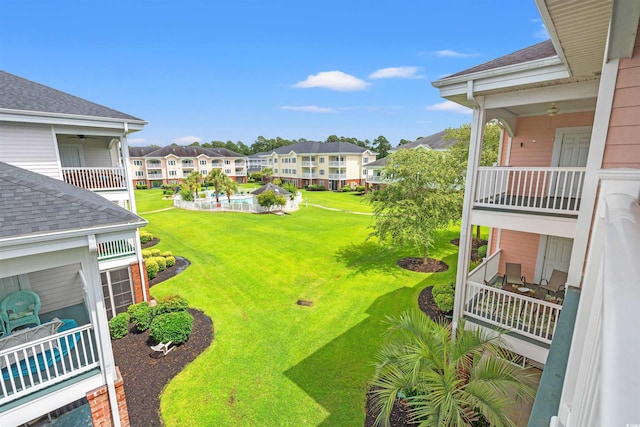 4846 Carnation Cir Unit 301, Myrtle Beach, SC 29577 - view of green lawn with a residential view, a balcony, and ceiling fan