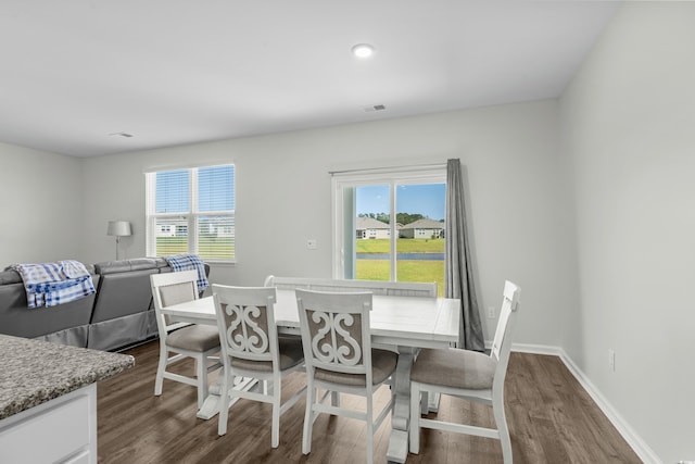 2106 Ainsley Dr, Little River, SC 29566 - dining area featuring dark wood-style floors and plenty of natural light