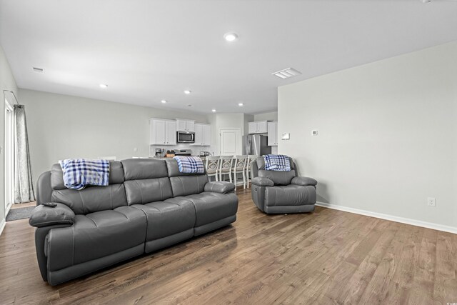 2106 Ainsley Dr, Little River, SC 29566 - living area featuring wood finished floors and recessed lighting