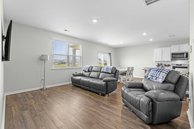 2106 Ainsley Dr, Little River, SC 29566 - living room featuring dark wood-type flooring and recessed lighting