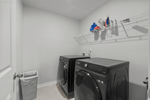 2106 Ainsley Dr, Little River, SC 29566 - laundry room featuring independent washer and dryer and light tile patterned flooring