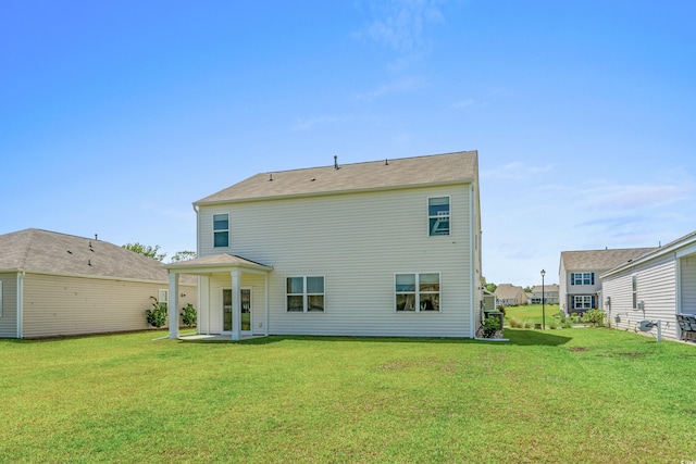 2106 Ainsley Dr, Little River, SC 29566 - rear view of property featuring a lawn