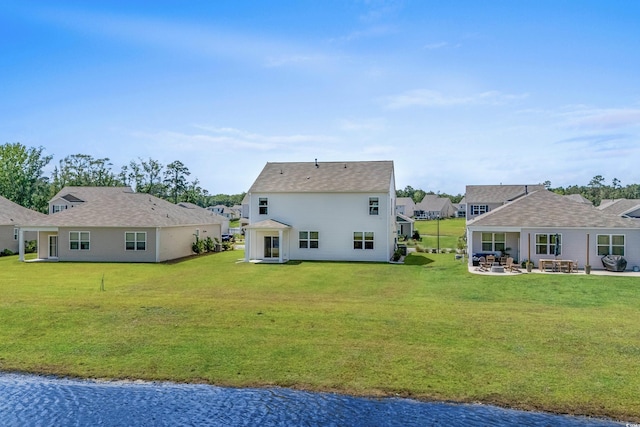 2106 Ainsley Dr, Little River, SC 29566 - back of property featuring a patio area, a lawn, and a water view